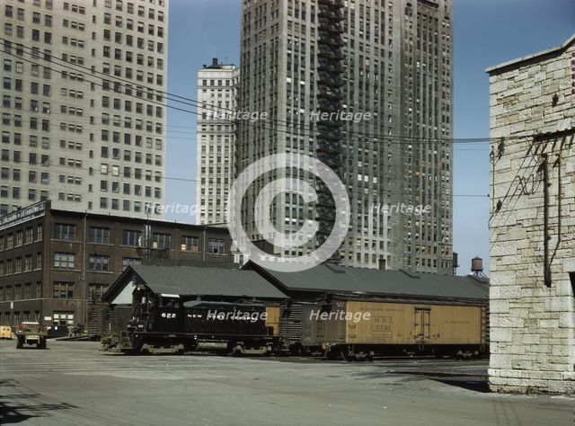 Diesel switch engine moving freight cars...South Water street...Illinois Central R.R., Chicago, 1943 Creator: Jack Delano.
