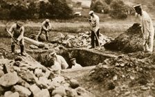 Digging mass graves behind the German lines, World War I, c1914-c1918. Creator: Unknown