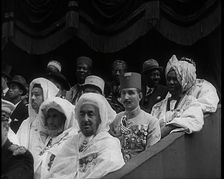 Dignitaries and Representatives from Various African Countries Sitting in Raked Seats at a..., 1939. Creator: British Pathe Ltd