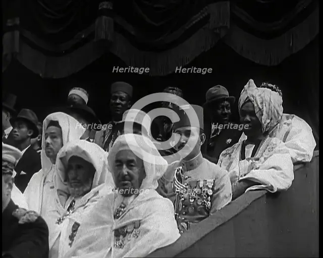 Dignitaries and Representatives from Various African Countries Sitting in Raked Seats at a..., 1939. Creator: British Pathe Ltd.