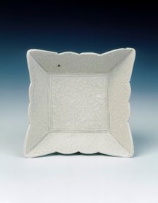 Ding type scalloped-edged square saucer with duck amid foliage, Liao dynasty, mid 11th century. Creator: Unknown