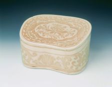 Ding bean-shaped pillow with sgraffito lotus design, Jin dynasty, China, 12th century. Creator: Unknown