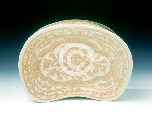 Ding bean-shaped pillow with sgraffito lotus design, Jin dynasty, China, 12th century. Creator: Unknown.