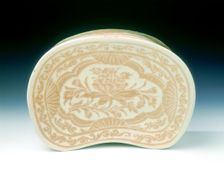 Ding bean-shaped pillow with sgraffito lotus design, Jin dynasty, China, 12th century. Creator: Unknown