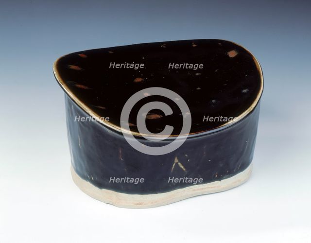 Ding black glazed pillow with hatched moulding, Jin dynasty, China, 12th century. Artist: Unknown