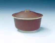 Ding persimmon red glazed covered bowl with white glazed interior, Jin dynasty, China, 12th century. Creator: Unknown
