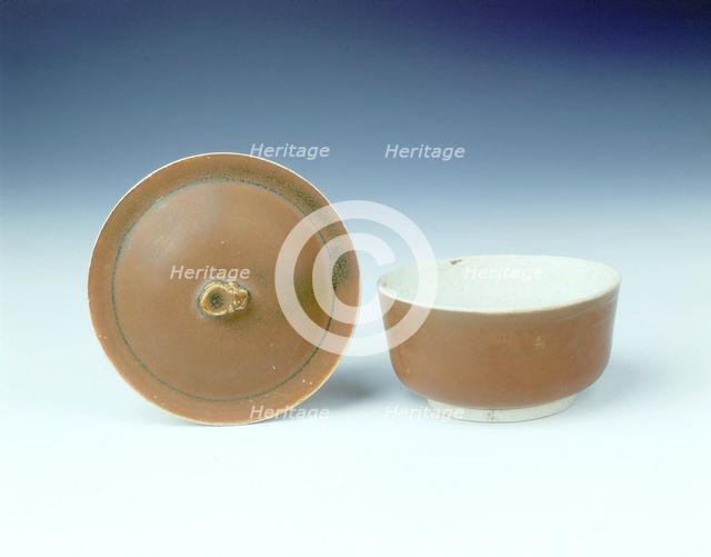 Ding persimmon red glazed covered bowl with white glazed interior, Jin dynasty, China, 12th century. Artist: Unknown