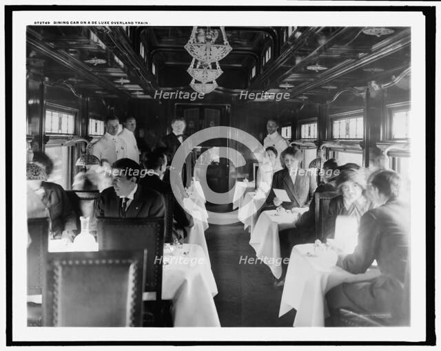 Dining car on a deluxe overland limited train, between 1910 and 1920. Creator: Unknown.