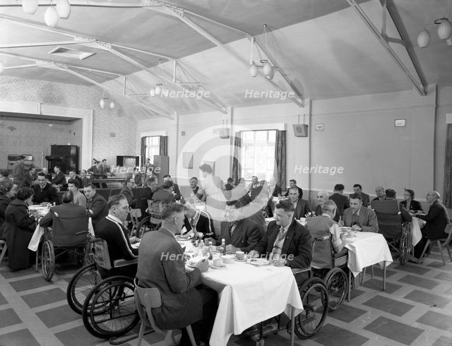 Dining hall of the CISWO paraplegic centre, Pontefract, West Yorkshire, 1960. Creator: Michael Walters.