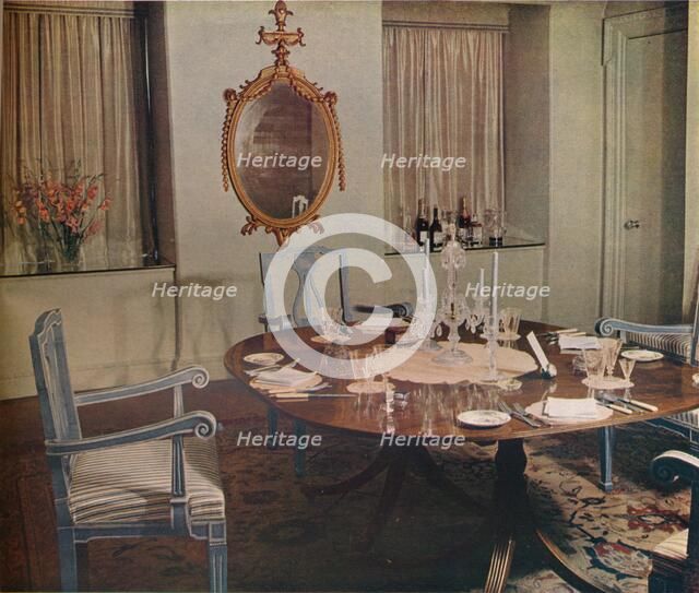 Dining room of the flat designed by Herman Schryver in Grosvenor Square, London, 1936. Artist: Unknown
