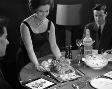 Dinner served, 1964. Creator: Michael Walters