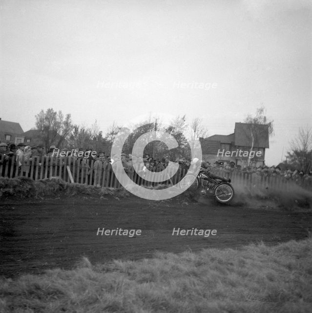 Dirt track motorcycle racing, Arlöv, Scania, Sweden, 1947. Creator: Otto Ohm.