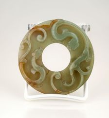 Disc with two animals in relief. Creator: Unknown