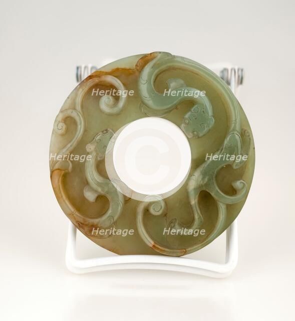 Disc with two animals in relief. Creator: Unknown.
