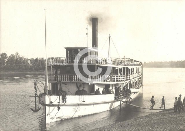 Disembarkation of passengers from the steamship "Russian" on the shore near the...Ovsyanki, 1909. Creator: Vladimir Ivanovich Fedorov.