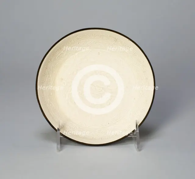Dish with Mythical Bovine (Xiniu) Amid Waves Viewing the Moon and..., Jin dynasty, 12th cent. Creator: Unknown.