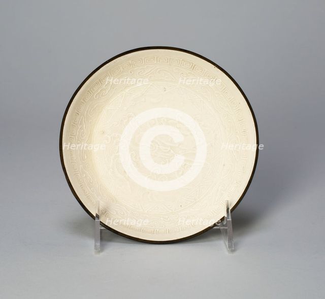 Dish with Mythical Bovine (Xiniu) Amid Waves Viewing the Moon and..., Jin dynasty, 12th cent. Creator: Unknown.