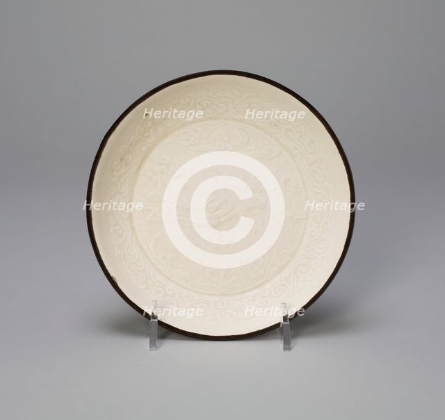 Dish with Mythical Bovine (Xiniu) amid Waves Viewing the Moon and..., Jin dynasty, 12th century. Creator: Unknown.