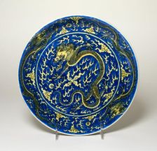 Dish with Dragons amid Clouds, Chasing Flaming Pearls, Qing dynasty, Kangxi reign mark (1662-1722). Creator: Unknown