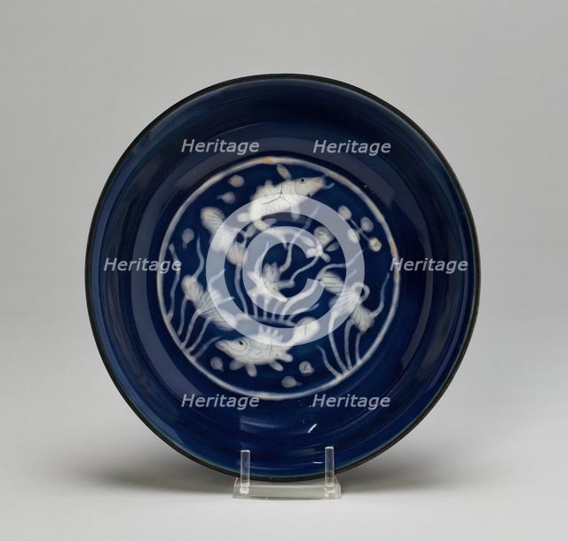 Dish with Fish Swimming in Lotus Pond, Ming dynasty (1368-1644), Wanli reign (1573-1620). Creator: Unknown.