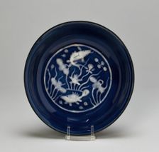 Dish with Fish Swimming in Lotus Pond, Ming dynasty (1368-1644), Wanli reign (1573-1620). Creator: Unknown