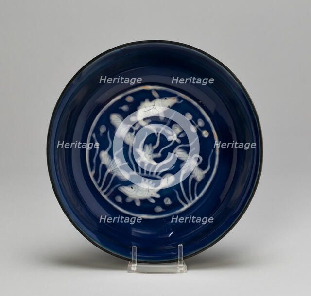 Dish with Fish Swimming in Lotus Pond, Ming dynasty (1368-1644), Wanli reign (1573-1620). Creator: Unknown.