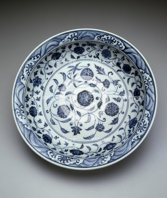 Dish with Scrolling Flowers and Breaking Waves, Ming dynasty (1368-1644), early 15th century. Creator: Unknown.