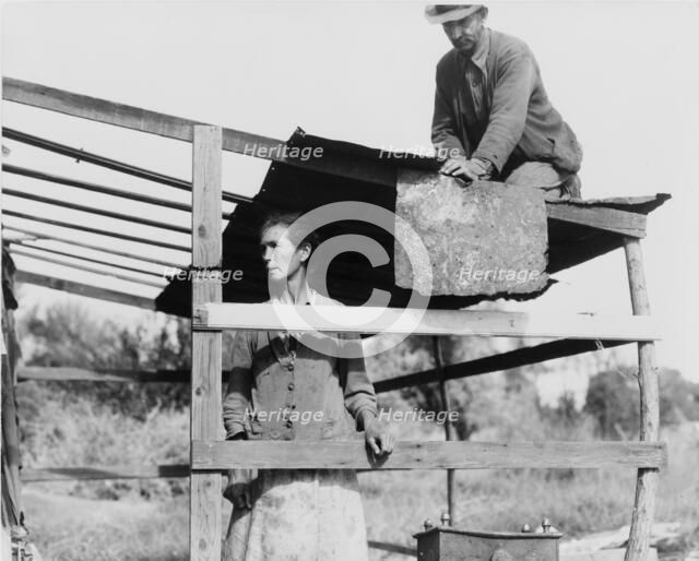 Dispossessed Arkansas farmers, Bakersfield, California, 1935. Creator: Dorothea Lange.
