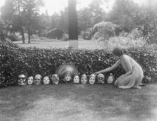 Display of masks made by W.T. Benda, not before 1925 Sept. 20. Creator: Arnold Genthe