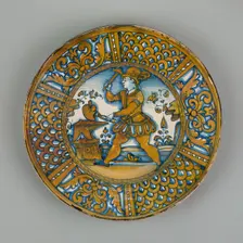 Display Plate with a Man Striking a Heart on an Anvil, Deruta, c. 1550. Creator: Unknown