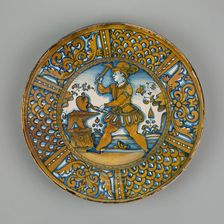 Display Plate with a Man Striking a Heart on an Anvil, Deruta, c. 1550. Creator: Unknown