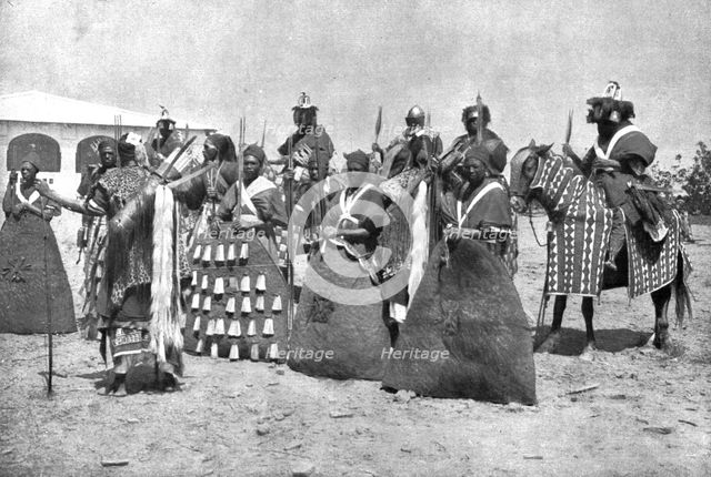 Distant Fronts, In Cameroon; Escort of the lamido of Rey Bouba,..., 191 Creator: Unknown.