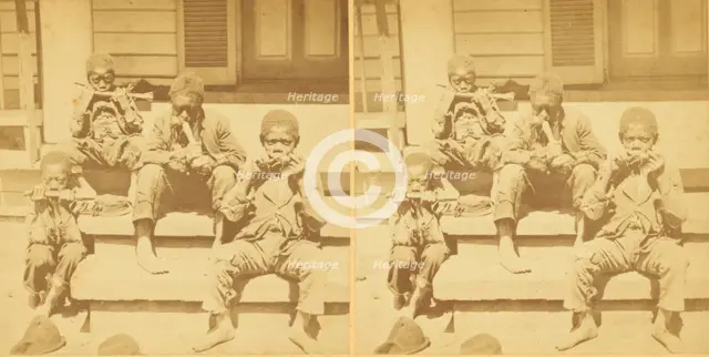 Distinguished southerners, grinding cane. [Children chewing sugar cane on the porch], (1868-1900?). Creator: Unknown.