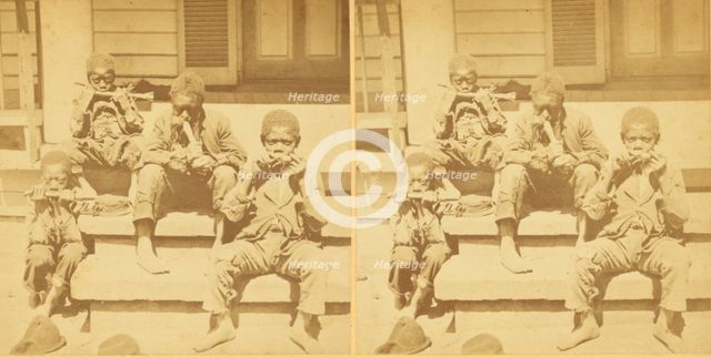 Distinguished southerners, grinding cane. [Children chewing sugar cane on the porch], (1868-1900?). Creator: Unknown.