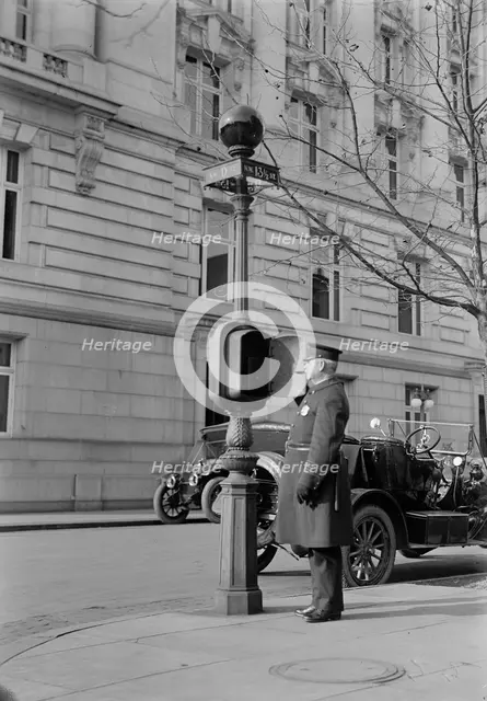 District of Columbia - Fire Alarm Box And Policeman, 1913. Creator: Harris & Ewing.
