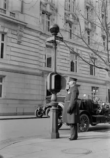 District of Columbia - Fire Alarm Box And Policeman, 1913. Creator: Harris & Ewing