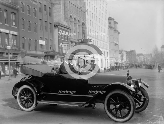 District of Columbia; Traffic - Stop And Go Signs, 1913. Creator: Harris & Ewing.