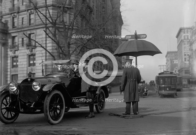 District of Columbia; Traffic. Stop And Go Signs, 1913. Creator: Harris & Ewing.