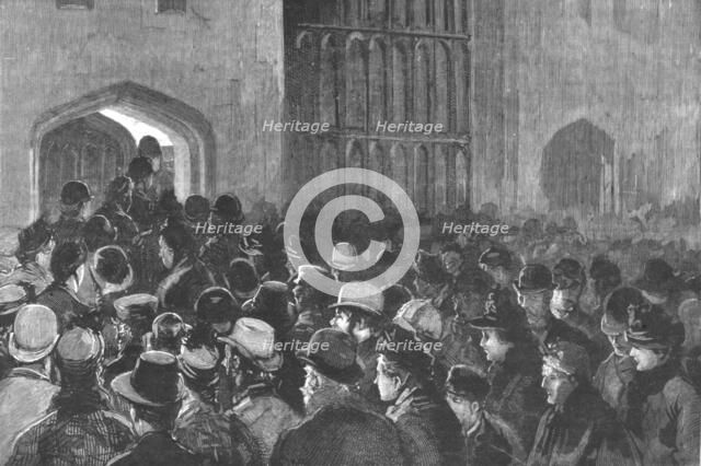 ''Distributing the Queen's New Year Gifts at Windsor; The crowd outside the Riding School...', 1890. Creator: Unknown.