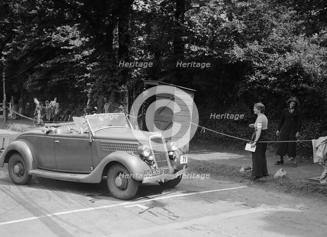 DJH Currie's Ford V8, winner of a silver award at the MCC Torquay Rally, July 1937. Artist: Bill Brunell.