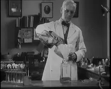 Dr Alexander Fleming, the Inventor of Penicillin, Experimenting in a Laboratory, 1929. Creator: British Pathe Ltd
