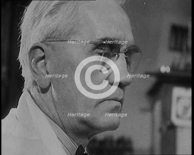 Dr Alexander Fleming, the Inventor of Penicillin, Experimenting in a Laboratory, 1929. Creator: British Pathe Ltd.