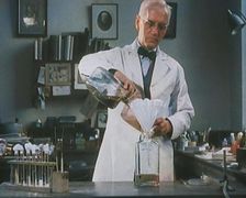 Dr Alexander Fleming, the Inventor of Penicillin, Experimenting in a Laboratory, 1929. Creator: British Pathe Ltd