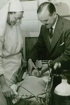 Dr Geoffrey Mutton and Matron Joan Gardner attend to a baby at St Monan's Hospital, c1950. Creator: Unknown
