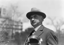 Dr. Maximilian Toch, standing outdoors, 1936. Creator: Arnold Genthe