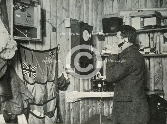 'Dr. Simpson in the Hut at the Other End of the Telephone Timing the Observation', c1911, (1913). Artist: Herbert Ponting.