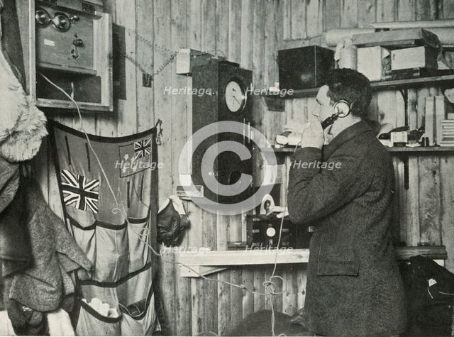 'Dr. Simpson in the Hut at the Other End of the Telephone Timing the Observation', c1911, (1913). Artist: Herbert Ponting.