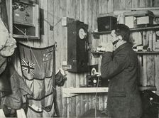 Dr. Simpson in the Hut at the Other End of the Telephone Timing the Observation c1911, (1913). Artist: Herbert Ponting