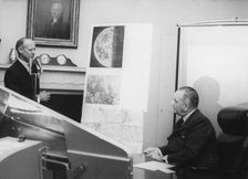 Dr William Pickering shows President Johnson photographs taken by Ranger VII, 1964