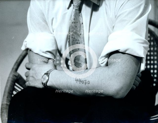 Dr Vrba displays his Auschwitz prison number, c1940s(?). Creator: Unknown.